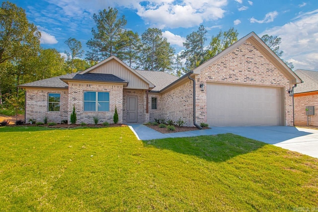 view of front of property with a garage and a front lawn