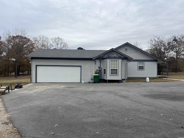 ranch-style home with a garage