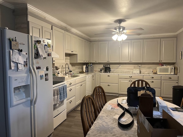 kitchen with white cabinetry, ceiling fan, white appliances, dark wood-type flooring, and sink