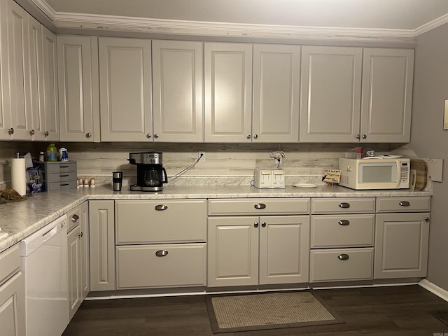 kitchen featuring backsplash, dark hardwood / wood-style floors, white appliances, and ornamental molding