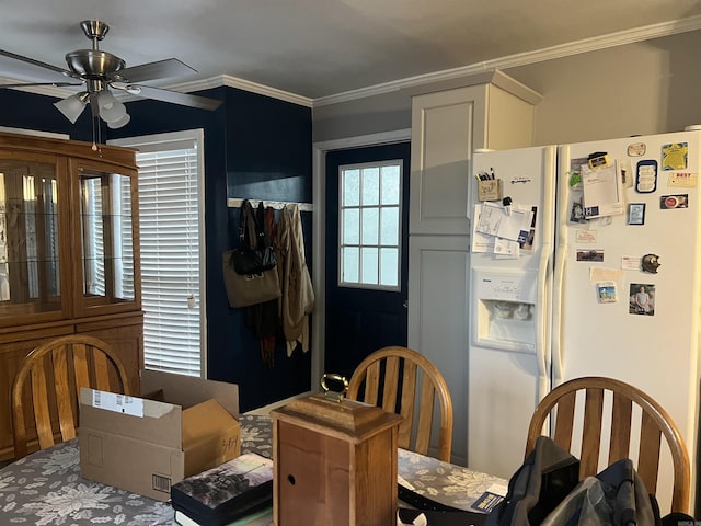 dining room with ceiling fan and crown molding