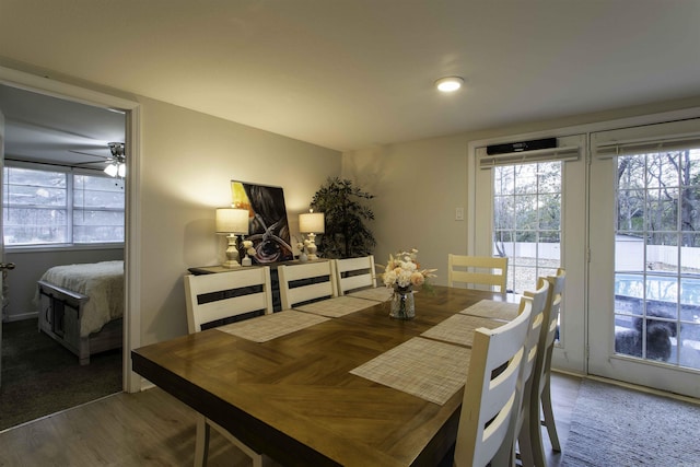 dining room with hardwood / wood-style flooring and ceiling fan