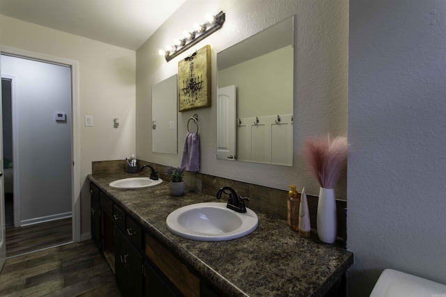 bathroom featuring vanity and hardwood / wood-style flooring