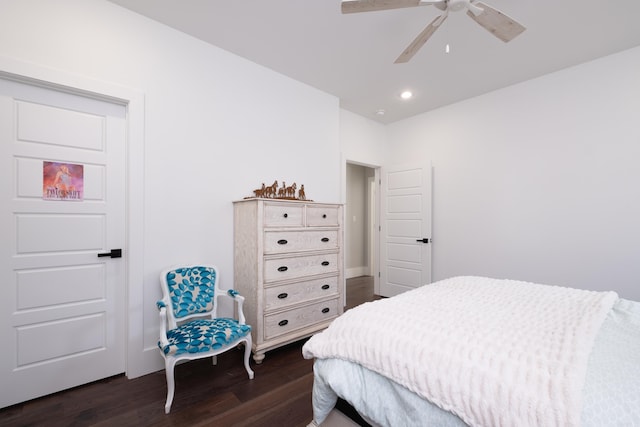 bedroom with ceiling fan and dark wood-type flooring