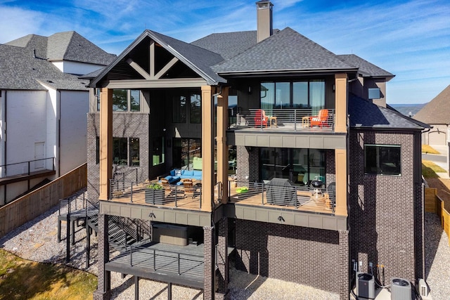 rear view of house featuring a balcony