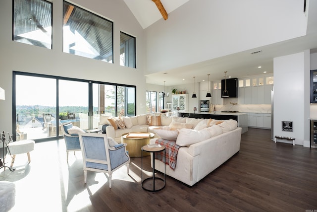 living room with dark wood-type flooring, sink, beam ceiling, high vaulted ceiling, and wine cooler