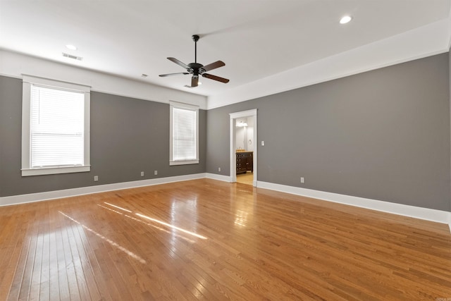 spare room featuring ceiling fan and light hardwood / wood-style flooring