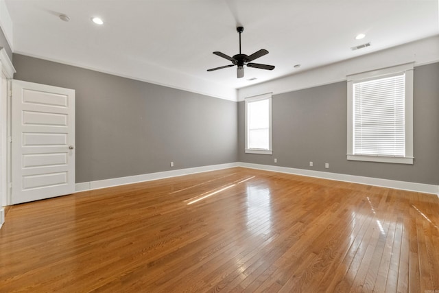 spare room with ceiling fan and hardwood / wood-style flooring