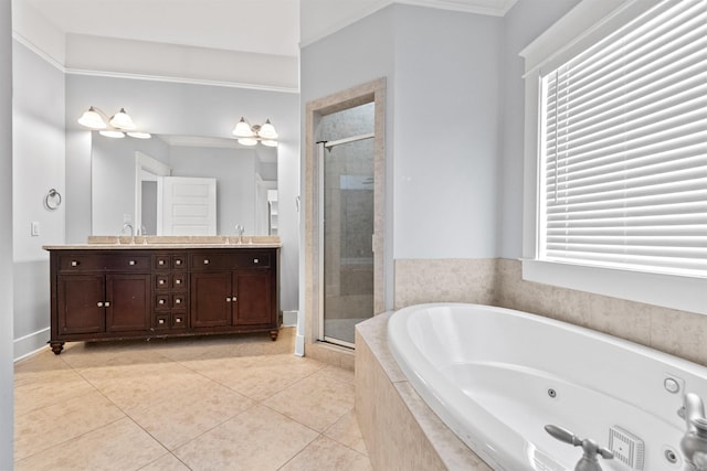 bathroom featuring a healthy amount of sunlight, vanity, and independent shower and bath