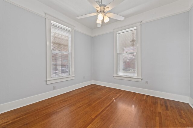 empty room featuring hardwood / wood-style floors and ceiling fan