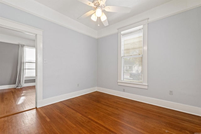 unfurnished room featuring hardwood / wood-style flooring, ceiling fan, and a wealth of natural light