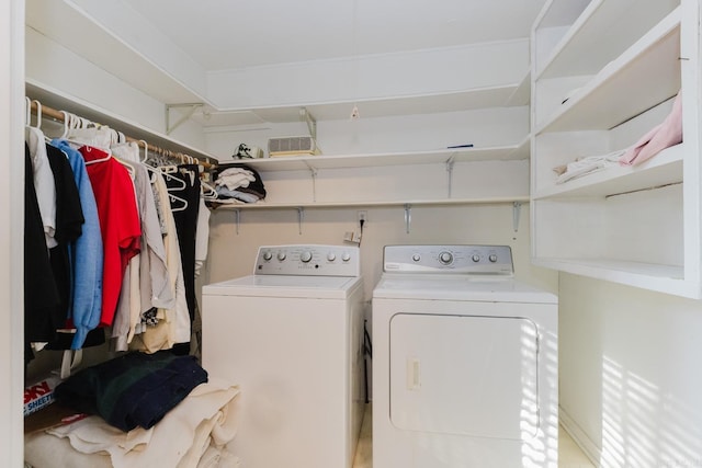 washroom with washing machine and clothes dryer