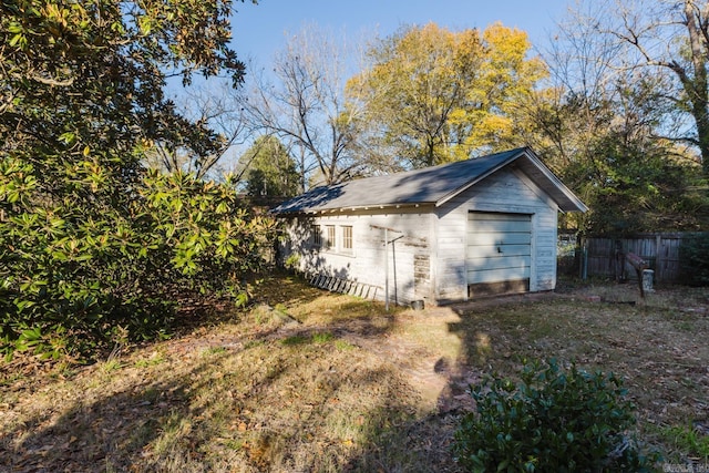 view of side of home with an outdoor structure