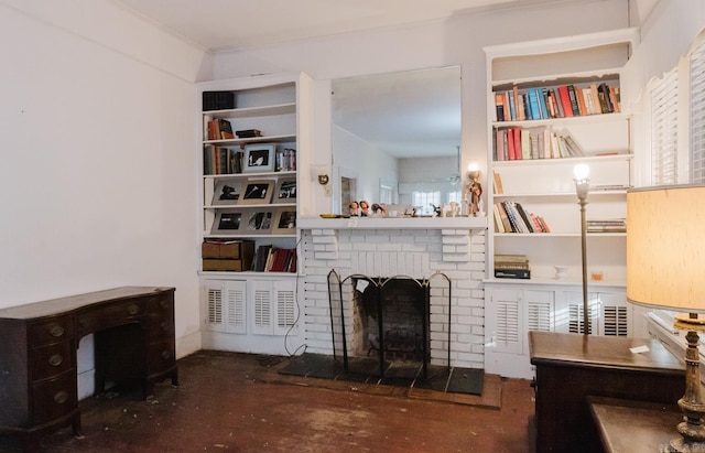 living room featuring crown molding, built in features, and a fireplace