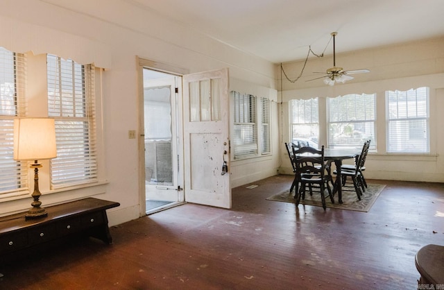 dining area featuring dark hardwood / wood-style floors and ceiling fan