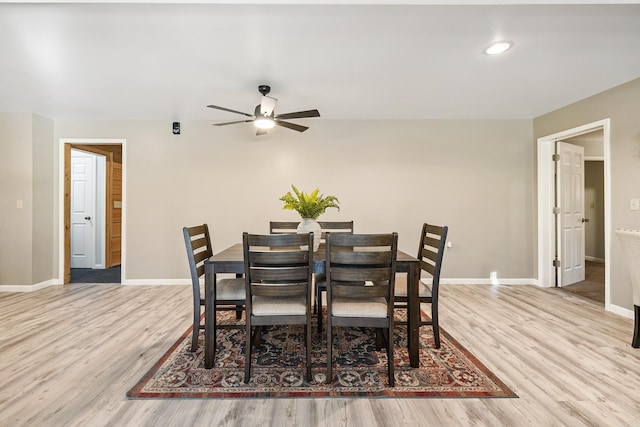 dining room with light hardwood / wood-style floors and ceiling fan