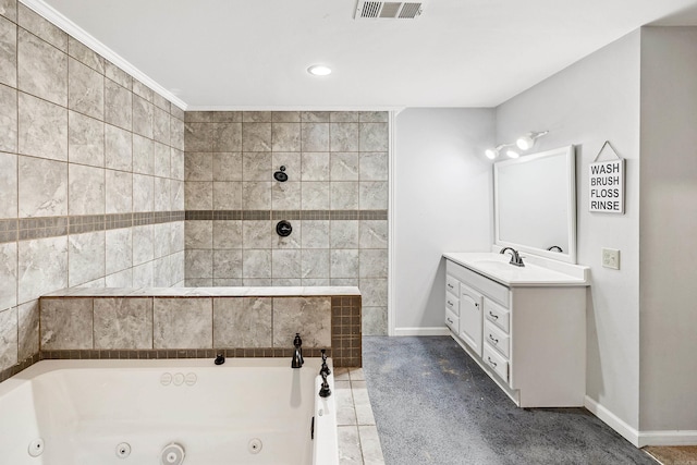 bathroom with crown molding, a bathtub, vanity, and tile patterned flooring