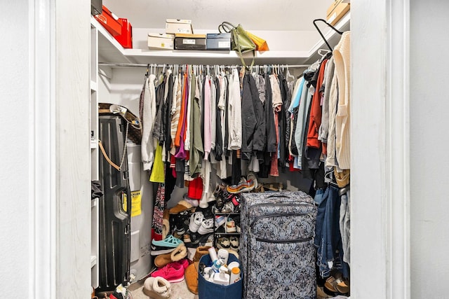 spacious closet featuring water heater