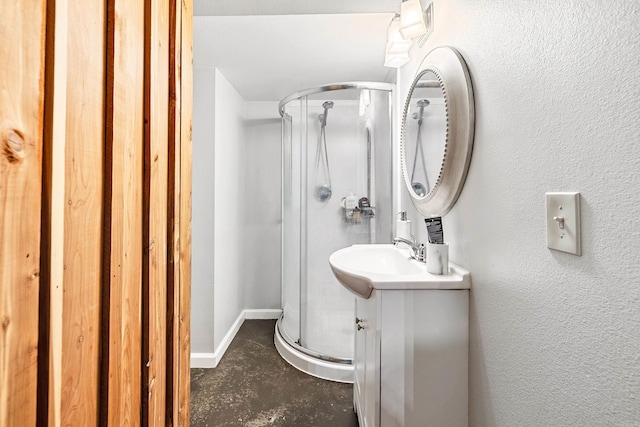 bathroom featuring vanity and an enclosed shower