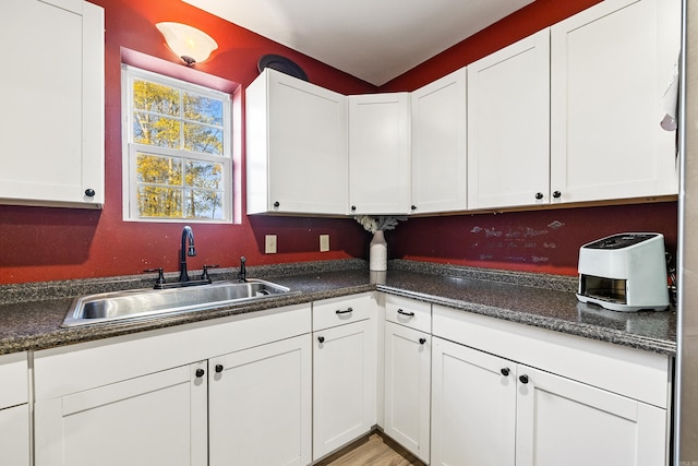 kitchen with white cabinets and sink