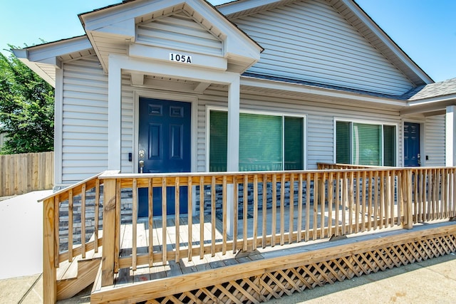 property entrance with a wooden deck