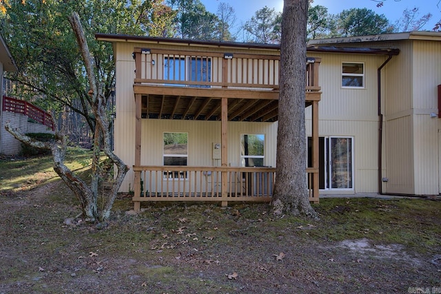 back of house featuring a deck