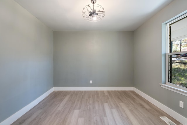 spare room featuring light wood-type flooring