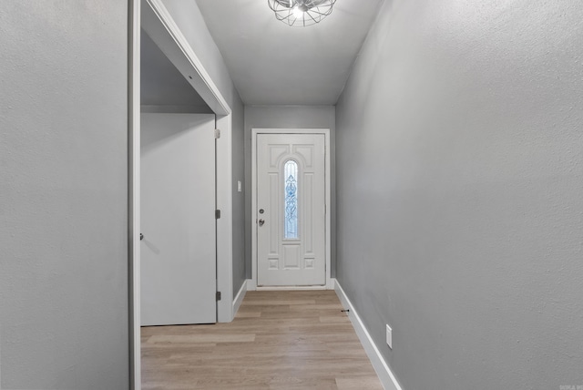 doorway to outside featuring light wood-type flooring