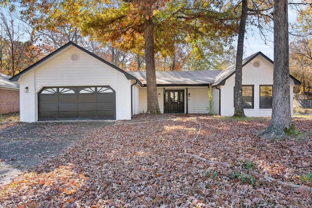 ranch-style house featuring a garage