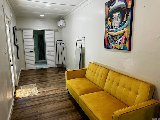 living room with an AC wall unit and dark wood-type flooring