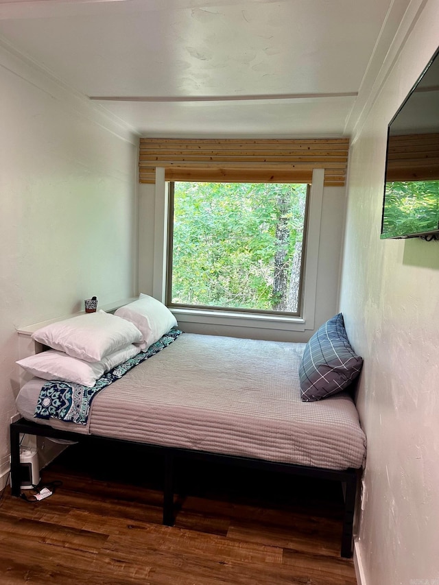 bedroom with wood-type flooring