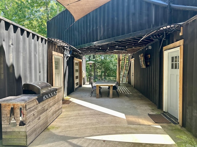 view of patio with an outdoor kitchen and area for grilling