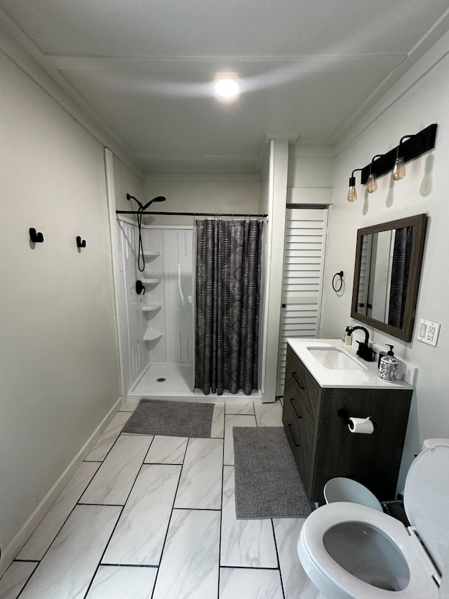 bathroom with curtained shower, vanity, ornamental molding, and toilet