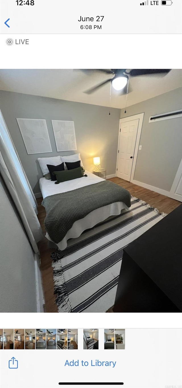 bedroom with ceiling fan and hardwood / wood-style floors