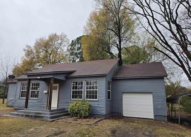 view of front of house featuring a carport and a garage