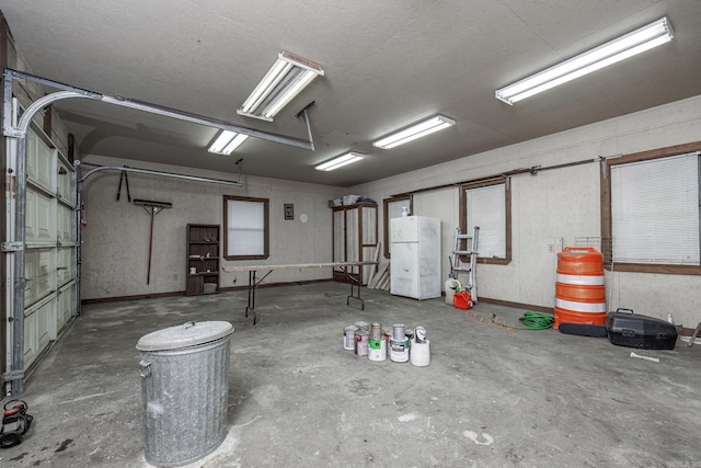 garage with white fridge