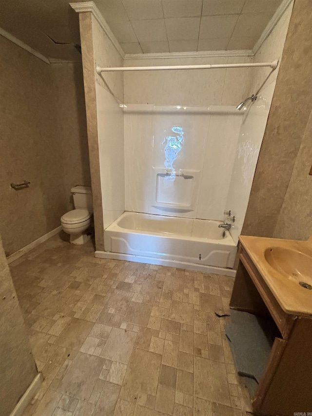 full bathroom featuring bathing tub / shower combination, crown molding, vanity, and toilet