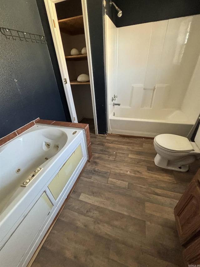 bathroom featuring hardwood / wood-style flooring and toilet