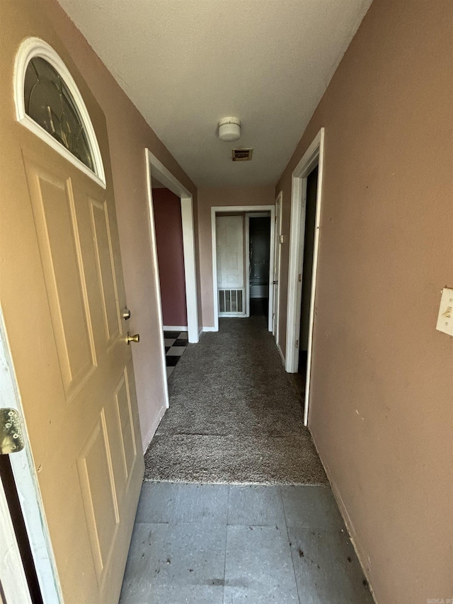 corridor with light colored carpet