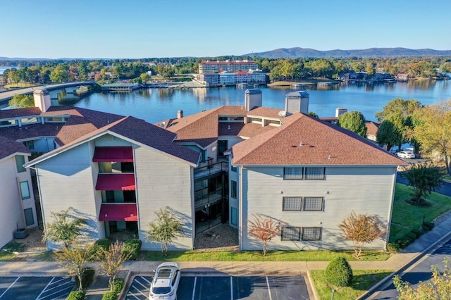 aerial view featuring a water and mountain view