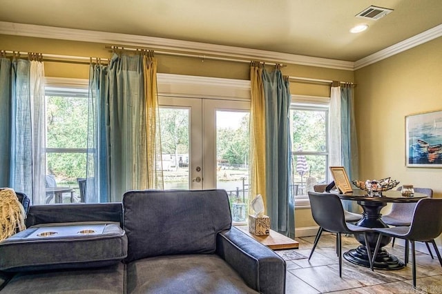 living area with french doors, a wealth of natural light, and crown molding