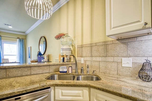 kitchen featuring backsplash, light stone counters, crown molding, sink, and dishwasher