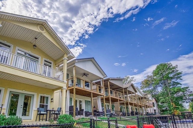 exterior space with ceiling fan