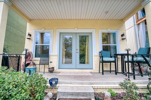 view of exterior entry featuring french doors