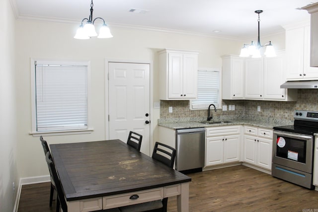 kitchen featuring white cabinets, appliances with stainless steel finishes, an inviting chandelier, and pendant lighting