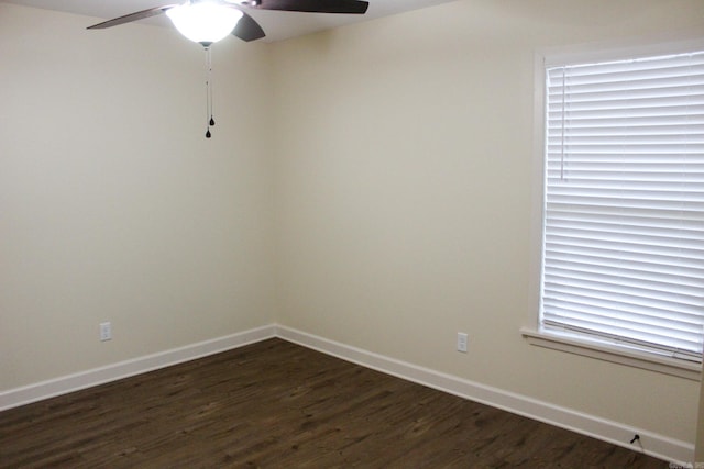 spare room featuring ceiling fan and dark hardwood / wood-style flooring