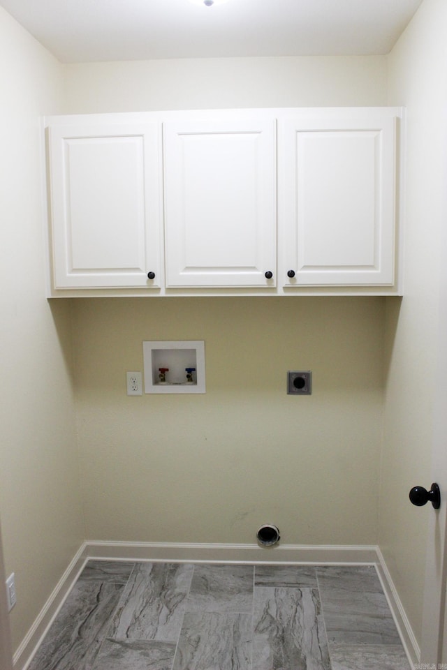 laundry room with hookup for a washing machine, cabinets, and electric dryer hookup