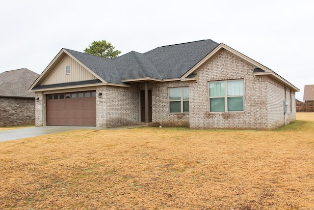 view of front of property with a garage and a front yard