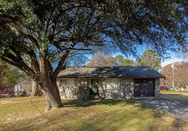 single story home with a front lawn and a garage