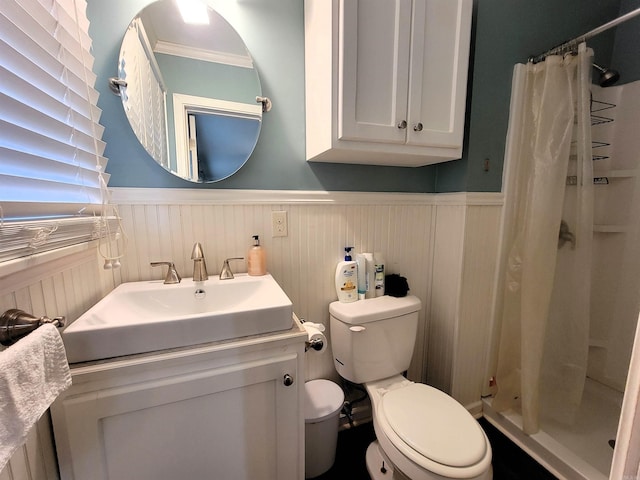 bathroom featuring vanity, toilet, and curtained shower